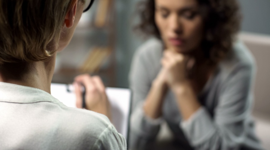 Depressed Woman w Doctor_Shutterstock_1204439623